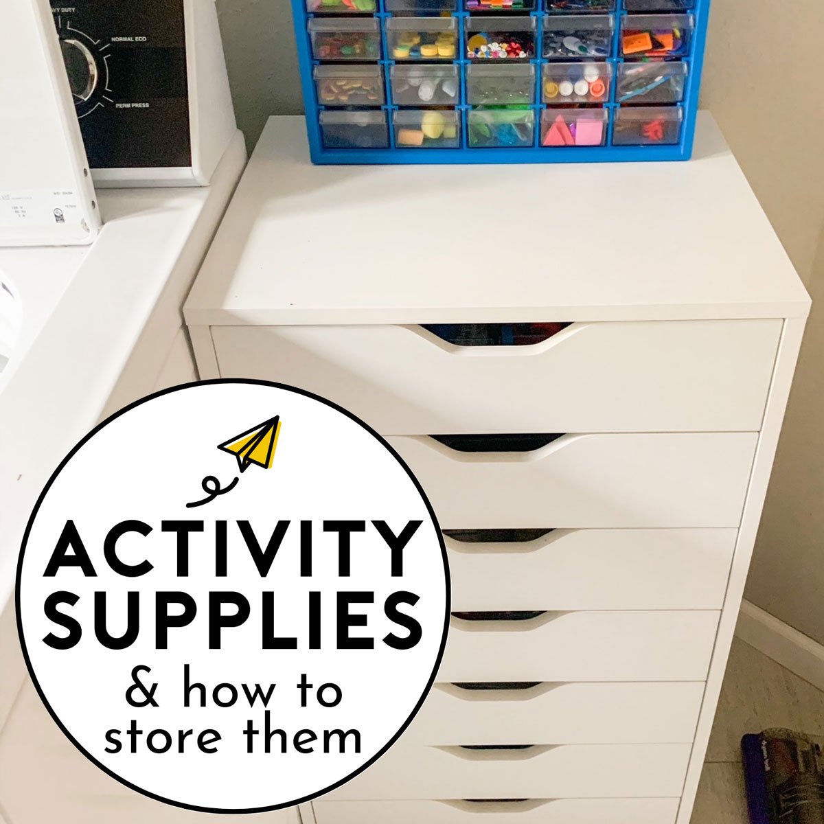 Activity supplies and how to store them: image shows a white set of drawers with a blue tackle box on top.