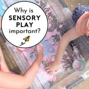 Why is sensory play important? Two children play in a sensory bin of oobleck.